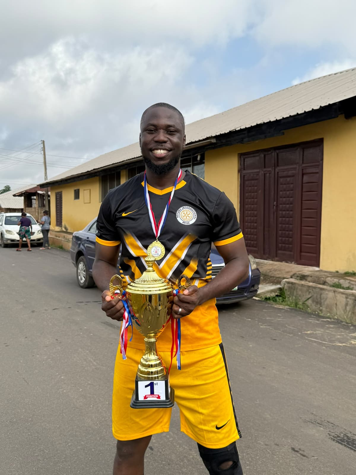 MC Kopsy — holding the 1st position trophy at Rotary sports